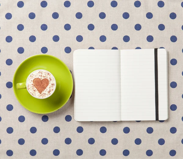 Kopje koffie en notebook — Stockfoto