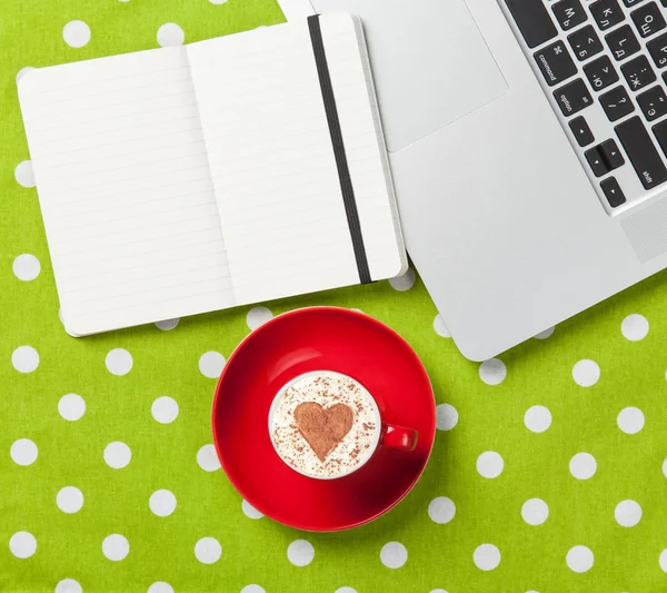 Cappuccino and notebook near laptop — Stock Photo, Image