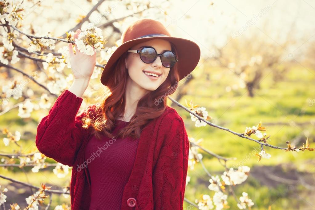 Woman in blossom apple tree garden