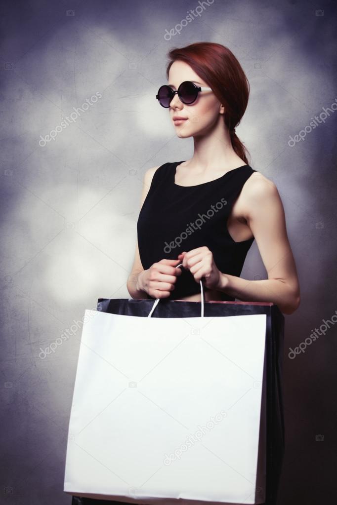 Style woman with shopping bags.