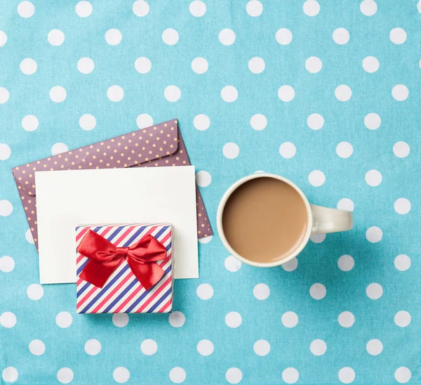 Cup of coffee and envelope — Stock Photo, Image