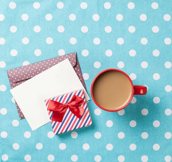 Cup of coffee and envelope — Stock Photo, Image