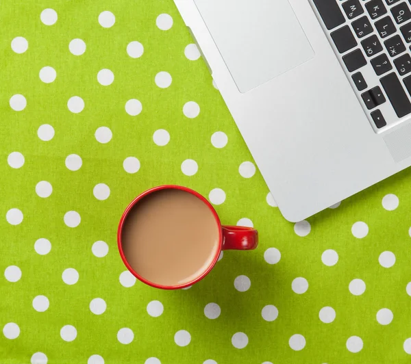 Cup of coffee and laptop computer — Stock Photo, Image