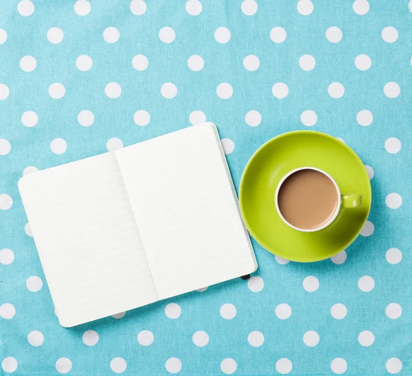 Taza de café y cuaderno — Foto de Stock