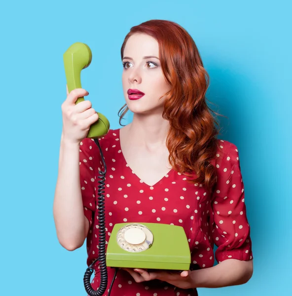 Girl in dress with green dial phone — Stock Photo, Image