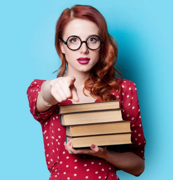 Ragazza in abito rosso con libri — Foto Stock