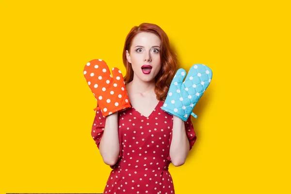 Girl in red dress with mittens — Stock Photo, Image