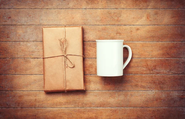 White cup and package — Stock Photo, Image