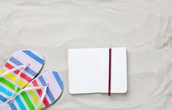 Flip flops and classic notebook with pencil — Stock Photo, Image
