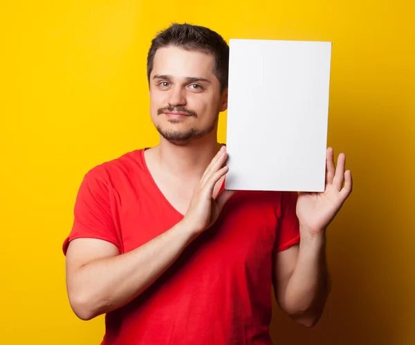 Smiling guy in shirt with white board — Stock Fotó