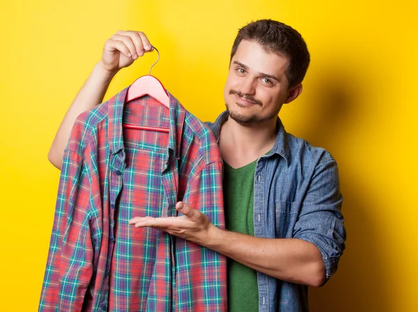 Guy with hanger and shirt — Stock fotografie