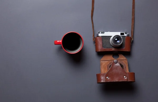 Cup of coffee and retro camera — Stock Photo, Image