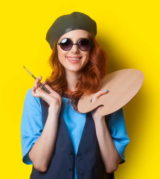 Surprised redhead girl with brush — Stock fotografie