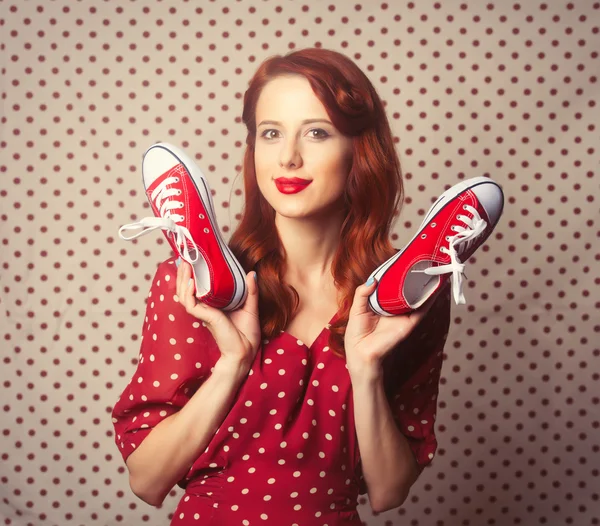 Portrait of redhead woman with gumshoes — Stok fotoğraf