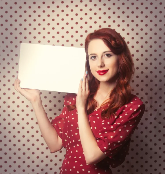 Portrait of a redhead  woman with white board — Zdjęcie stockowe