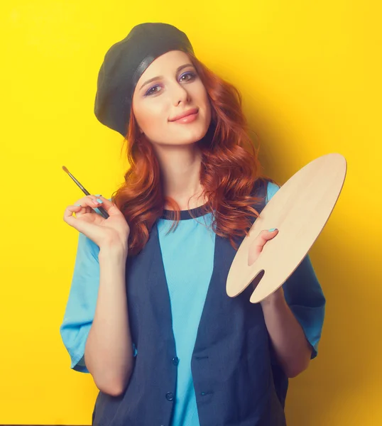 Woman with palette and brush — Stockfoto