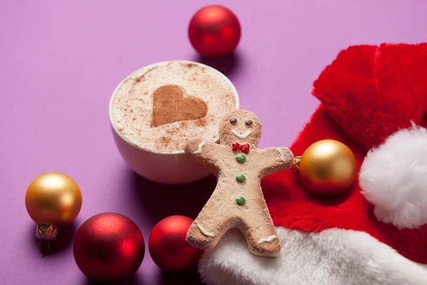 Cup of coffee and Santas hat — Stock Photo, Image