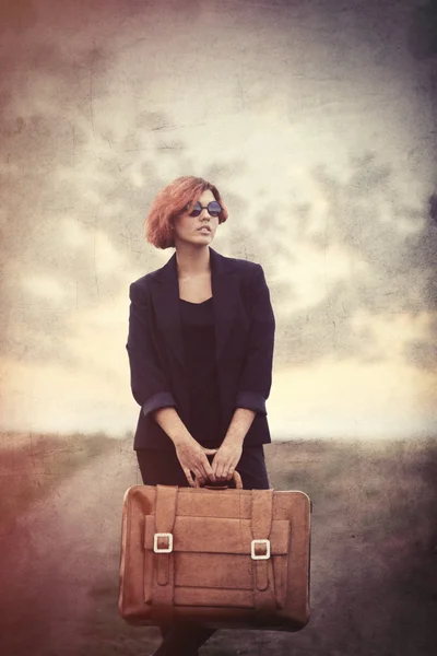 Style young woman with suitcase — Stock Photo, Image