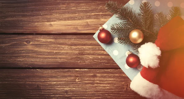 Santas hat and christmas bubbles — Stock Photo, Image