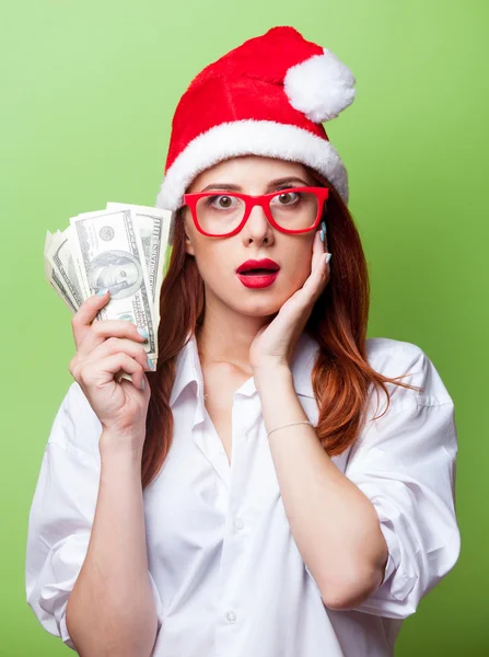 Γυναίκα με καπέλο Χριστούγεννα με χρήματα — Φωτογραφία Αρχείου
