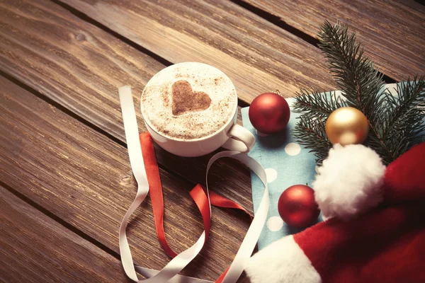 Christmas bubbles and Santas hat — Stock Photo, Image