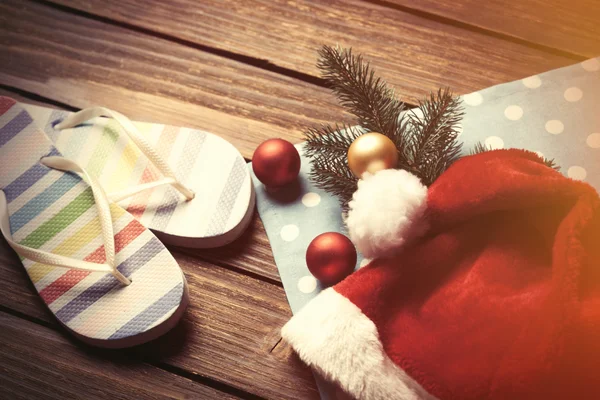 Santas hat and christmas bubbles — Stock Photo, Image