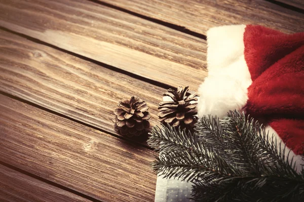 Santas hat and branch — Stock Photo, Image