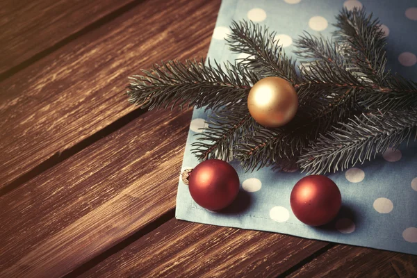 Christmas bubbles and branch — Stock Photo, Image