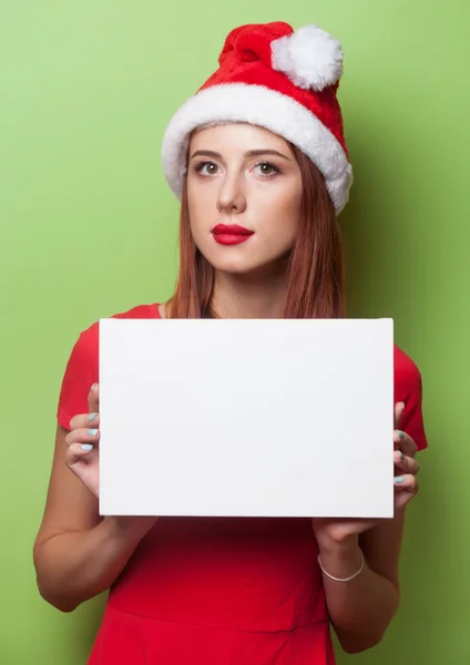 Žena v klobouku vánoční desku — Stock fotografie