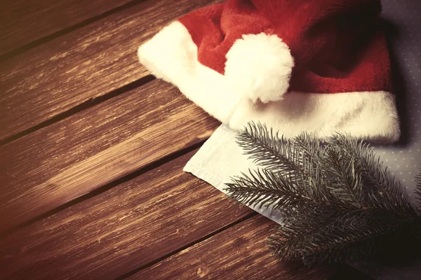 Santas hat and branch — Stock Photo, Image