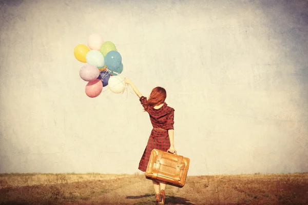 Ragazza con palloncini multicolori — Foto Stock