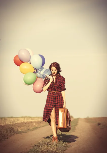 Ragazza con palloncini multicolori — Foto Stock