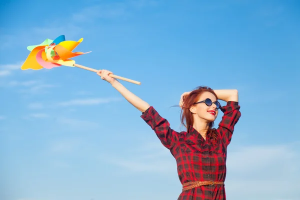 Chica con juguete de viento — Foto de Stock