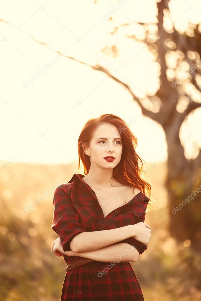 Beautiful girl in plaid dress