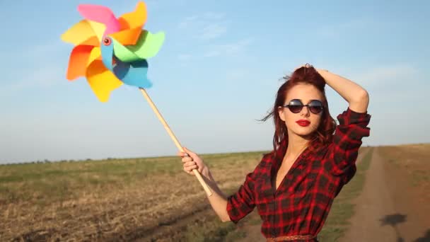 Young girl with wind toy — Stock Video