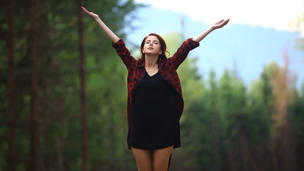 Happy young woman raising her arms — Stock Video