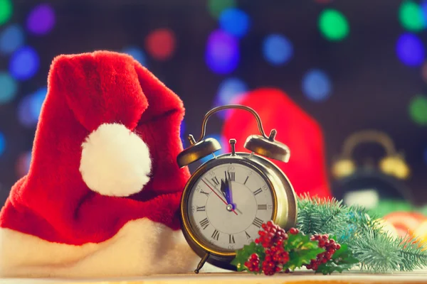 Santas hat and  alaram clock — Stock Photo, Image