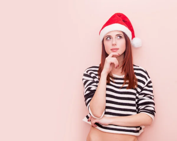 Mujer en santa claus sombrero — Foto de Stock