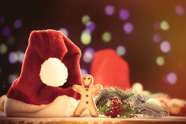 Santas hat and gingnerbread — Stock Photo, Image