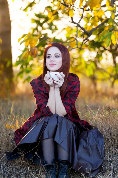 Woman with cup of tea or coffee — Stock Photo, Image