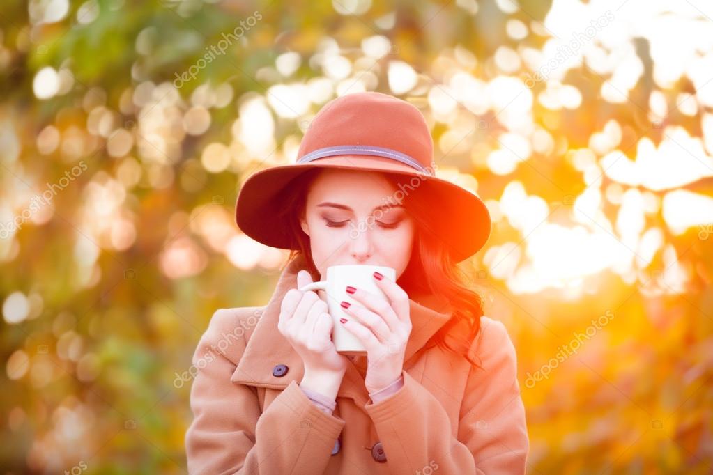 Woman with cup of tea or coffee
