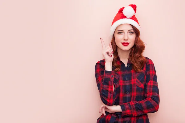 Noel Baba şapkalı kız. — Stok fotoğraf
