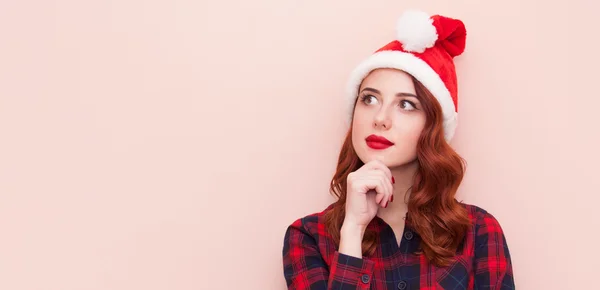Flicka i jultomten hatt — Stockfoto