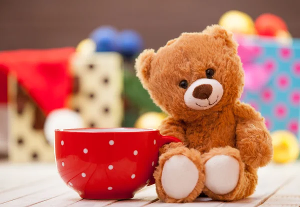 Teddy bear with cup of coffee or tea — Stock Photo, Image