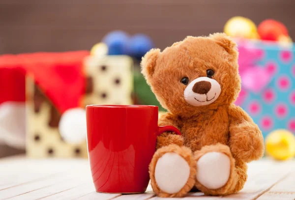 Teddy bear with cup of coffee or tea — Stock Photo, Image