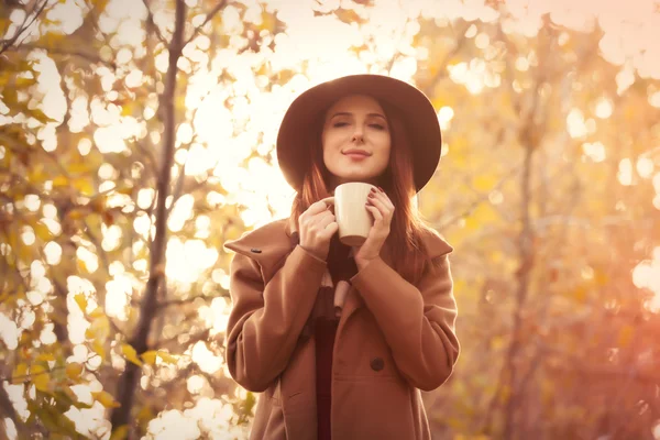 Woman in coat with hat — Stock Photo, Image