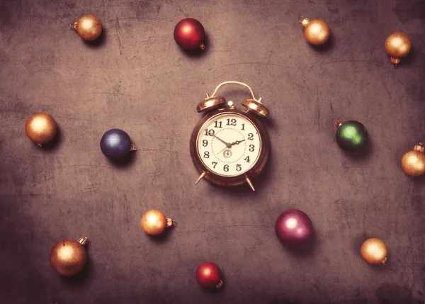 Baubles and alarm clock — Stock Photo, Image