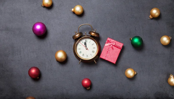 Gift and alarm clock with baubles — Stock Photo, Image