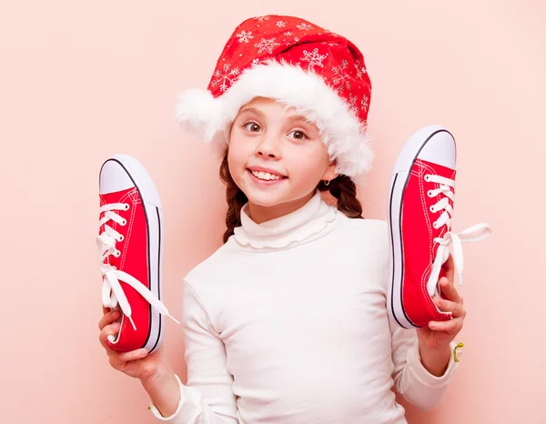 Chica con zapatos de goma y sombrero de Santa Claus —  Fotos de Stock