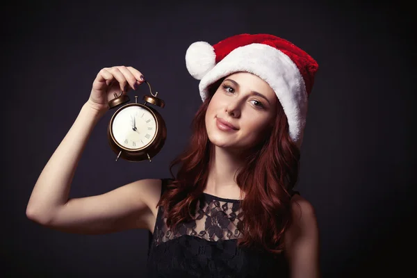 Woman in hat with clock — Stock Photo, Image